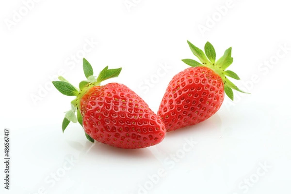 Fototapeta Two strawberries close up on white background. Fresh ripe whole strawberries.
