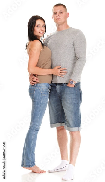 Fototapeta Portrait of a beautiful young happy smiling couple isolated