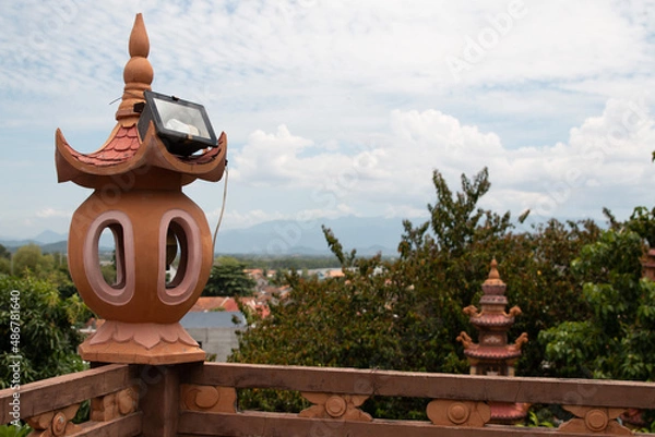 Fototapeta Arabic stone lanterns illuminate the path outside the hotel