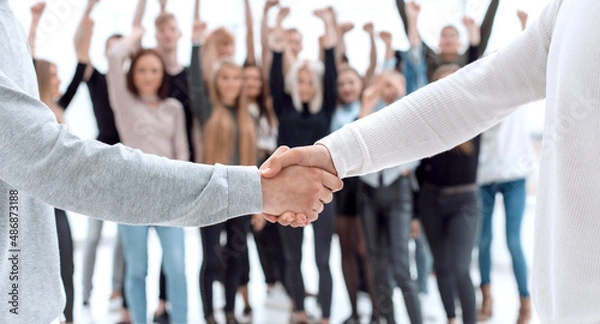 Obraz young business people shaking hands with each other