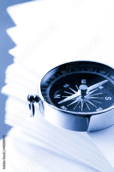 Fototapeta Stack of white cards and compass