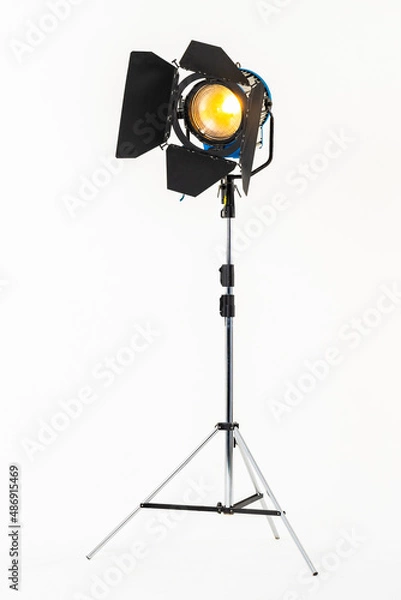 Fototapeta Professional film warm lighting, stage light with barndoors on a stand isolated on a white background