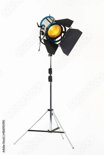 Fototapeta Professional film warm lighting, stage light with barndoors on a stand isolated on a white background