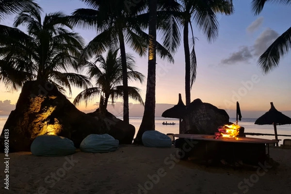 Obraz Exotic sunrise on the tropical beach with palms and bonfire 