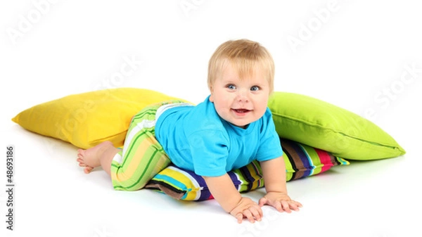 Obraz Little boy and color pillows, isolated on white