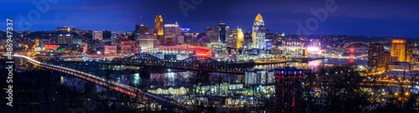 Fototapeta Cincinnati, Ohio USA - February 12, 2022: Panoramic View of the Cincinnati Skyline Lit Up in Orange in Honor of the Cincinnati Bengals NFL team having made it to the Superbowl