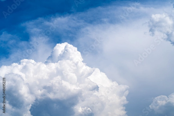 Obraz Photo of the sky with fluffy cumulus clouds