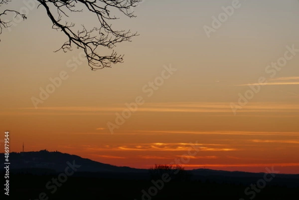 Fototapeta Beautiful Sunset in Bavaria with Branches 2022
