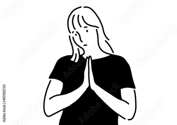 Fototapeta 手を合わせて謝っている女の人。