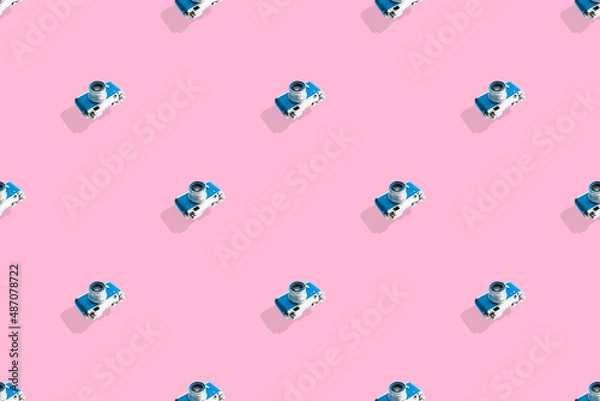 Fototapeta Seamless pattern from old cameras .Background on the theme of photography and photographic equipment. 