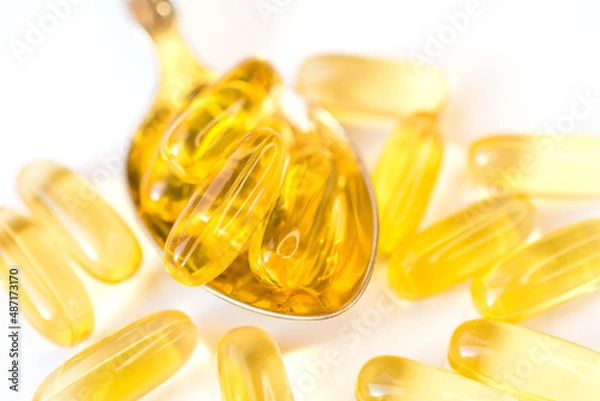 Fototapeta omega 3 vitamins yellow capsules close
