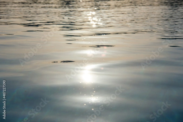 Fototapeta Closeup surface of blue clear water with small ripple waves in swimming pool