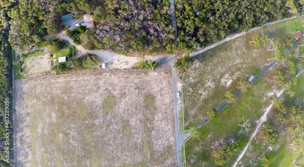 Fototapeta Birds-eye-view of field and road