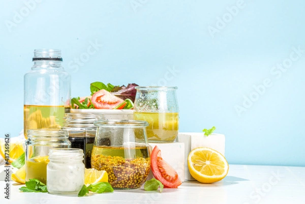 Obraz Variety of homemade salad dressings. Set of various salad sauces, oil, vinaigrette, mustard, mayonnaise, ranch, balsamic, soy, yogurt dressings