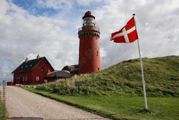 Fototapeta Red lighthouse in Denmark with a road