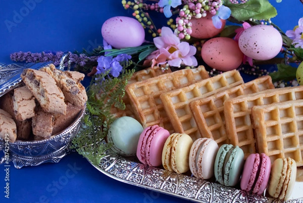 Obraz macarons and various sweet treats photographed with Easter decor
