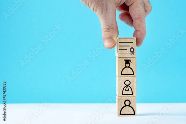 Fototapeta Wooden cubes with student icons