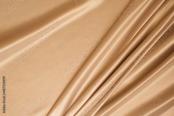 Fototapeta Beautiful elegant wavy beige satin silk luxury cloth fabric with monochrome background design. 