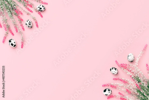 Fototapeta Easter composition. Easter eggs, flowers, paper blank on pastel pink background. Flat lay, top view, copy space.