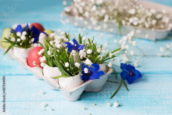 Obraz Easter. Painted eggs. Grass and flowers in a shell. Easter Still Life