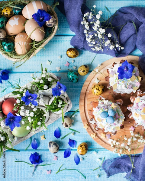 Obraz Easter cupcakes. Painted eggs. Grass and flowers in a shell. Easter still life. Easter background