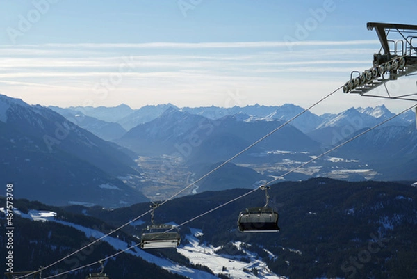 Fototapeta ski lift and the alps in tirol in the background - ski slopes rosshütte