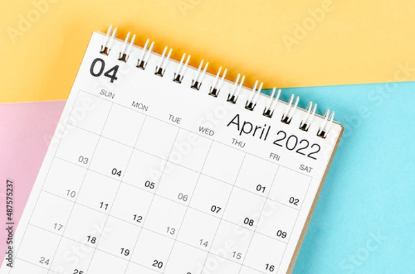 Fototapeta April 2022 desk calendar on multicolored background.