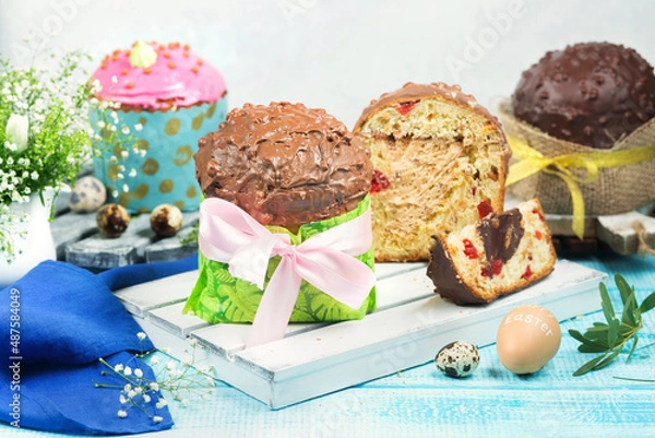 Obraz Easter cakes. Painted eggs. Easter background. Spring still life. Panettone with chocolate. 