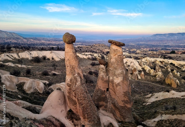Fototapeta Three Graces in Cappadocia, Nevsehir, Turkey. Fairy chimneys. Turkish name is "Üç Güzeller".  Selectively focused on Three Graces.