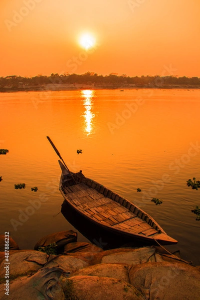 Fototapeta Sunset photography on the river in winter 2022. This image was taken by me on January 17, 2022, from the Doleswori river, Bangladesh, South Asia.