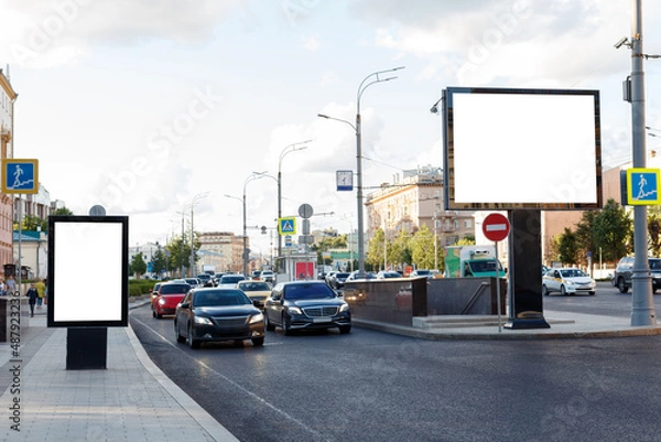 Fototapeta Two empty billboards on the side of the road in the city. Mock-up.