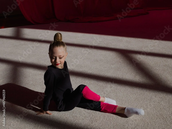 Fototapeta girl in rhythmic gymnastics training
