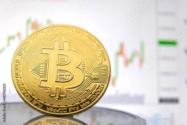 Fototapeta bitcoin coin on the background of the graph close-up