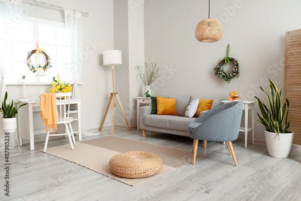 Fototapeta Interior of room with modern furniture and beautiful Easter decor