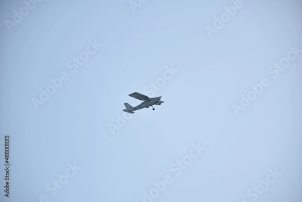 Fototapeta Perspective view of light aircraft in flight