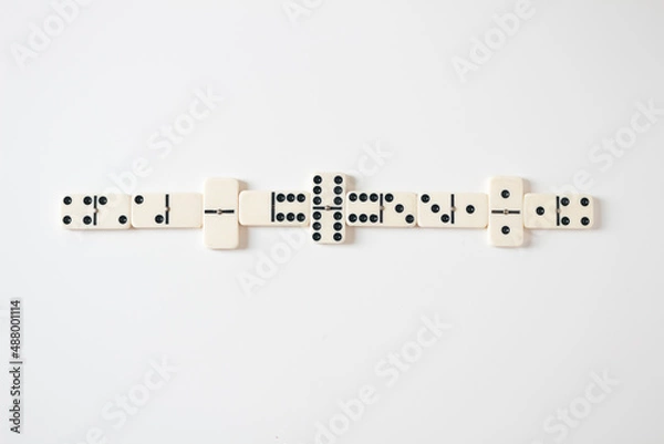 Fototapeta Vintage domino on white background. Close up, flat lay, top view, copy space.