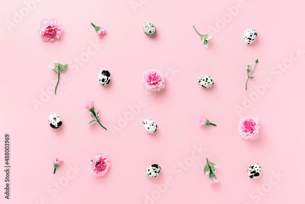 Fototapeta Easter concept with spring herbs, flowers and eggs on pastel pink background close up. Minimal easter concept. Flat lay with copy space.