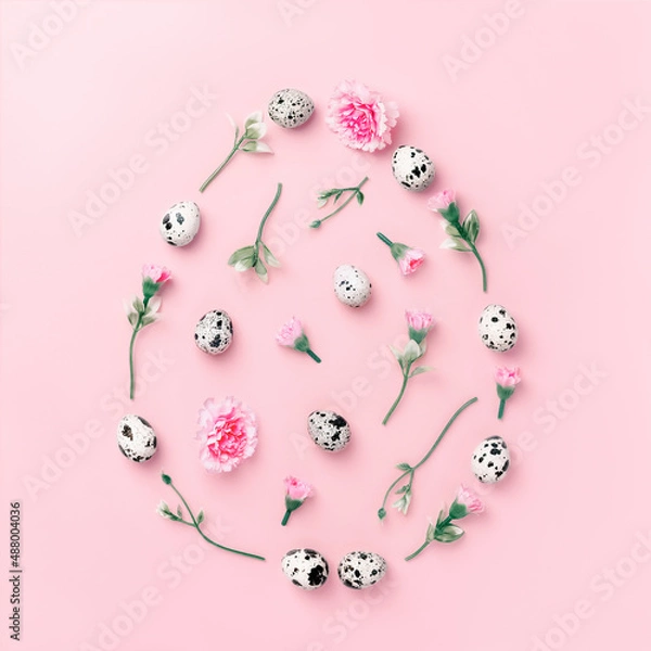 Fototapeta Easter composition egg shape made of colorful spring flowers and green leaves on pink pastel background. Minimal easter concept. Flat lay with copy space.