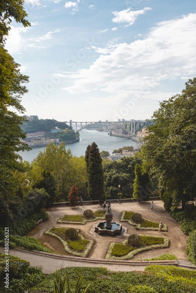 Fototapeta Views of the Arrábida Bridge over the Douro River in Porto, with the beautiful gardens of the Crystal Palace Park in the foreground.