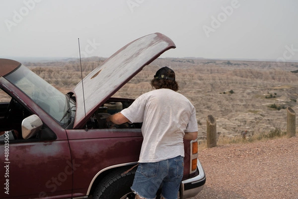 Obraz man fixing truck 