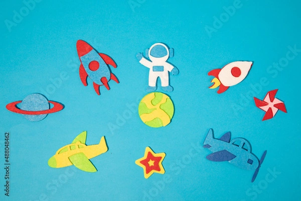 Obraz The launch into space. Flying rocket through the clouds. Start up of the space rocket. Rocket ship in flat design on blue background. 3d paper . Concept of business launch. Paper cut. High quality