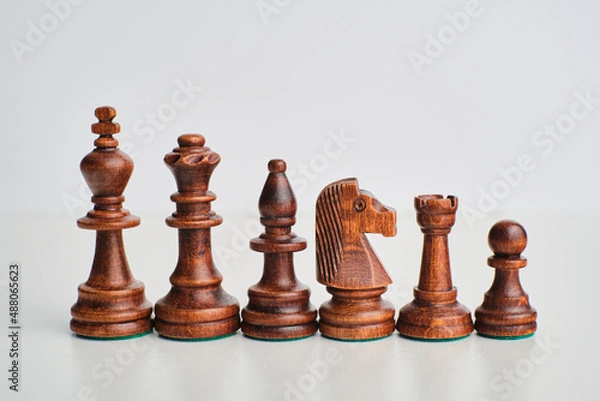 Fototapeta chess pieces on the white background, isolated
