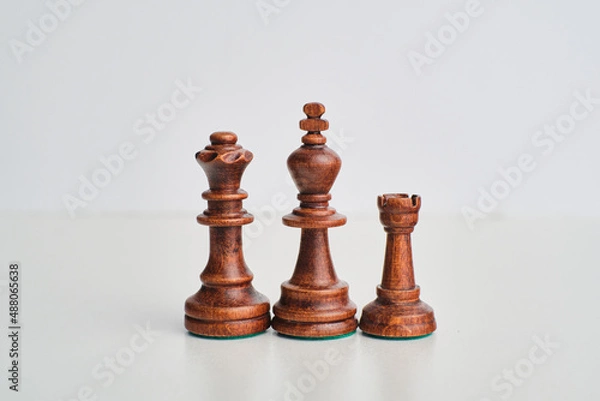 Fototapeta chess pieces on the white background, isolated