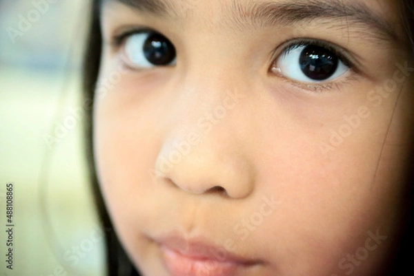 Obraz extreme close up of beautiful little girl looking at the camera