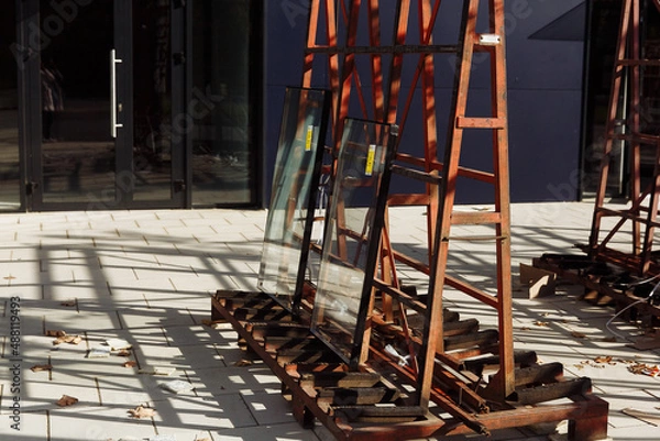Obraz double-glazed windows on an iron stand stand outside