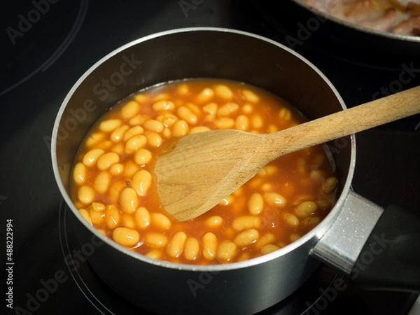Fototapeta Bubbly hot baked beans (brown sugar recipe) right out of the oven. Closeup with shallow dof.