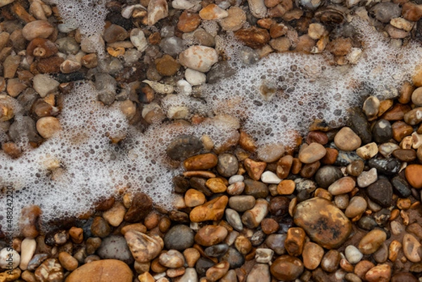 Obraz Pebble beach and sea foam