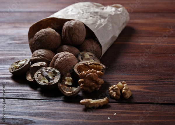 Obraz Nuts on a wooden background