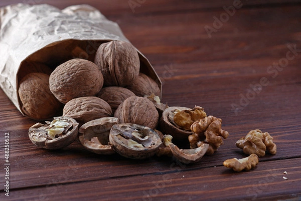 Obraz Nuts on a wooden background