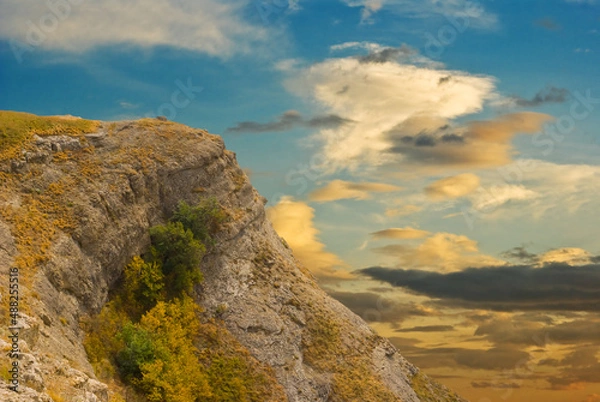 Fototapeta alone mount at the evening on  dramatic sky background